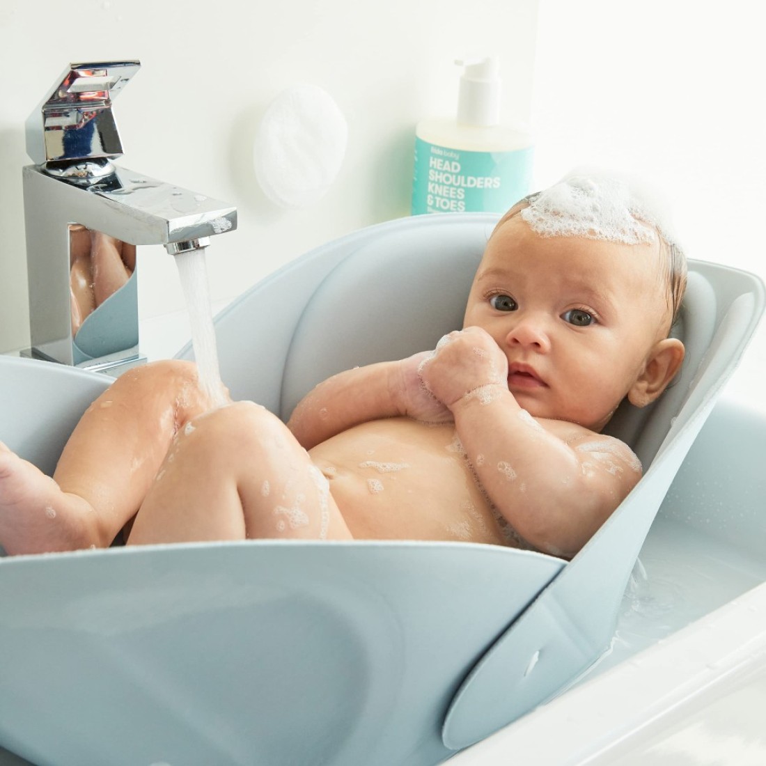 Frida Baby Soft Sink Baby Bath Seat Sink Bather for Baby Easy to Clean Baby Bathtub Bath Cushion That Supports Babys Head